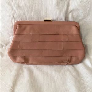 Pink leather clutch